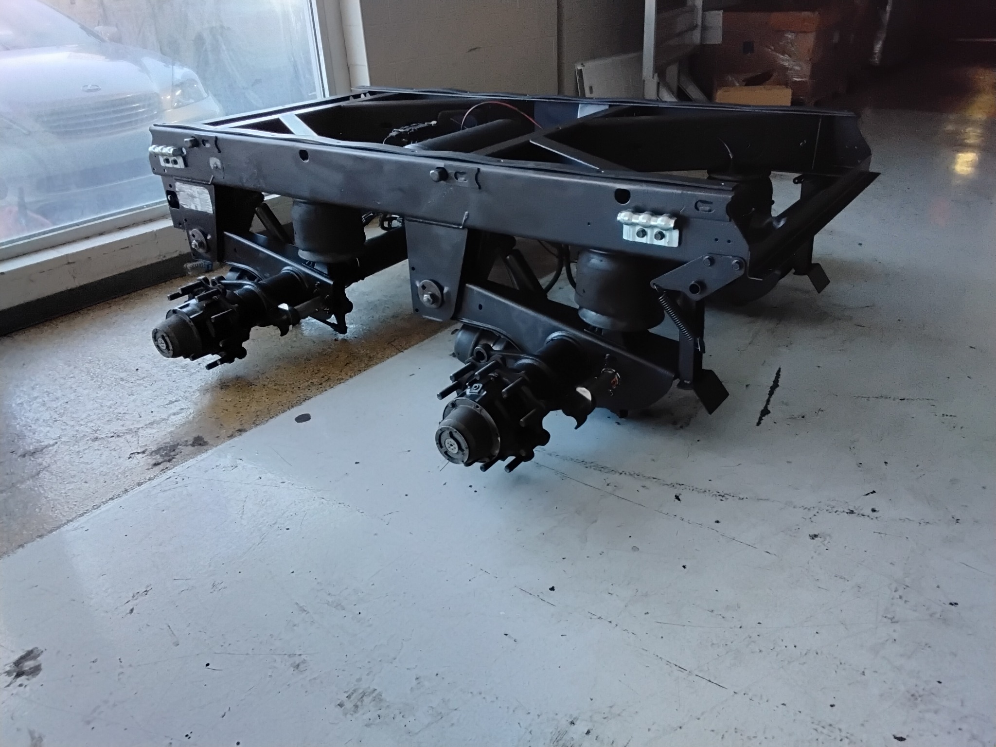 Refurbished heavy-duty trailer suspension assembly
